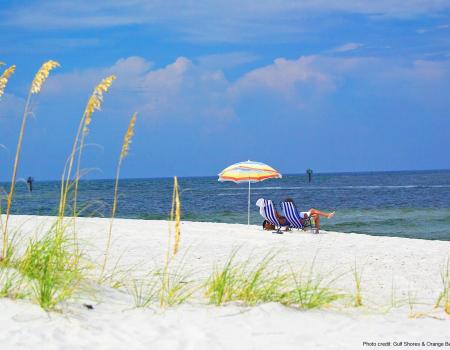 Couple on the beach in beach chairs
