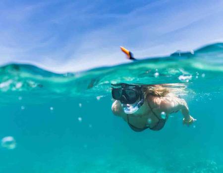 Girl snorkeling in Gulf Shores