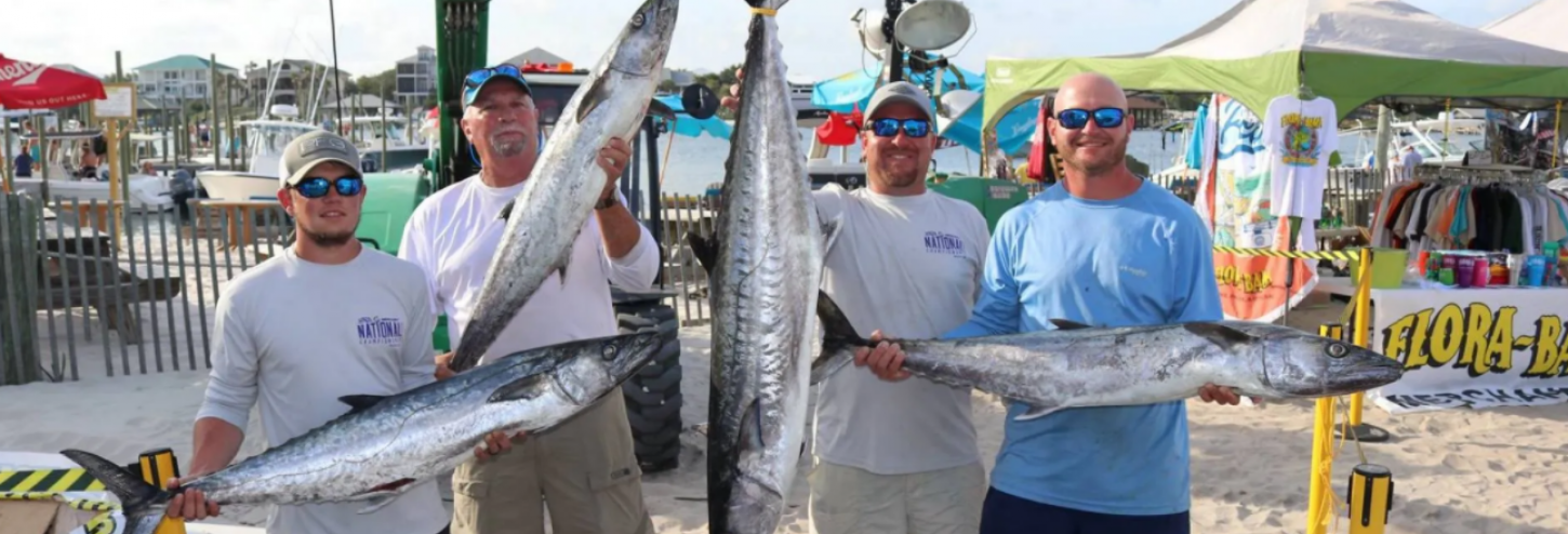 Men with fish from tournament