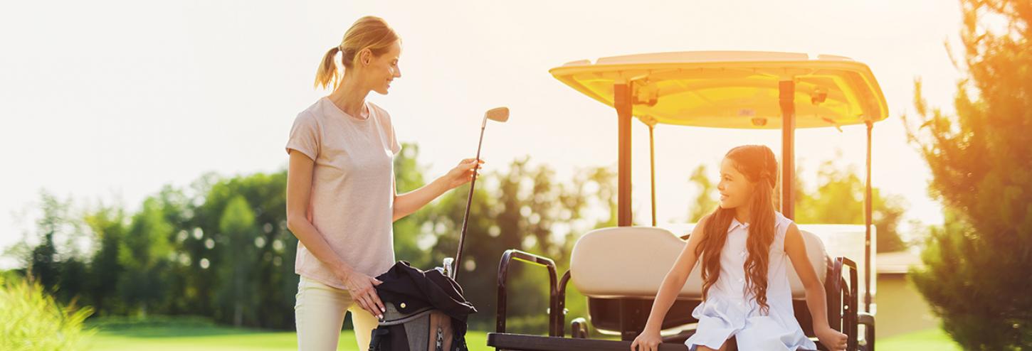 Mom golfing with daughter