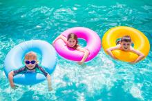 Children swimming in gulf shores beach houses with private pool