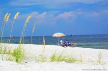 Couple on the beach in beach chairs