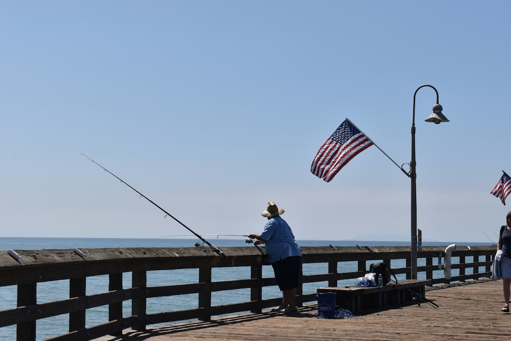 Man fishing from pier