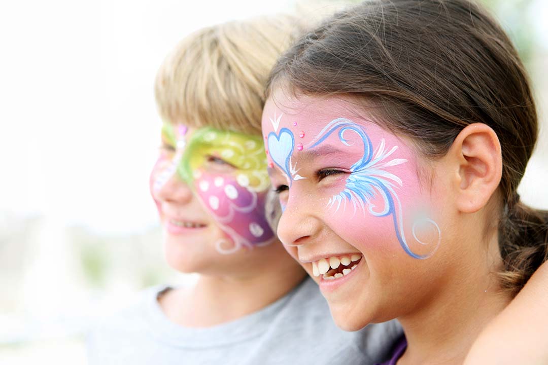 Young boy and girl with facepaint on