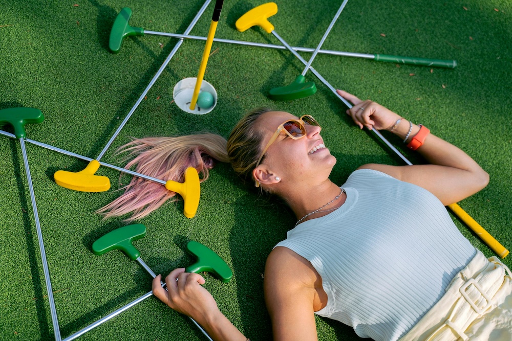 Woman laying on Mini golf course