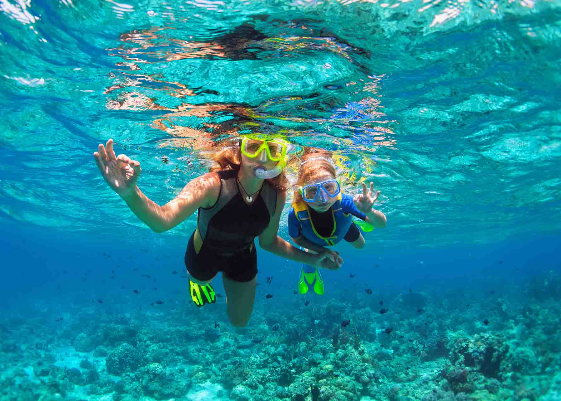 Mom and daughter snorkeling in Gulf Shores